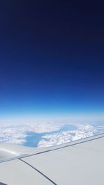 Scenic view of mountains against blue sky