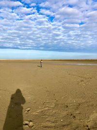 Shadow of person on beach