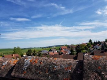 Houses in town against sky