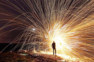 Blurred motion of woman at night