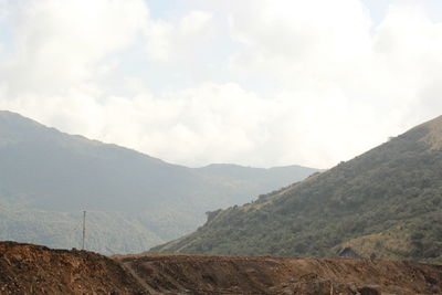 View of mountain range against cloudy sky