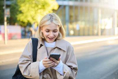 Young woman using mobile phone