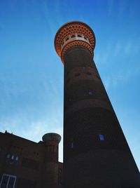 Low angle view of building against cloudy sky