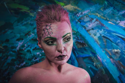 Portrait of young woman in swimming pool