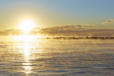 Scenic view of sea against sky during sunrise