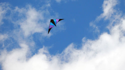 Low angle view of kite flying in sky