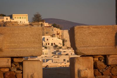 Buildings in town against sky