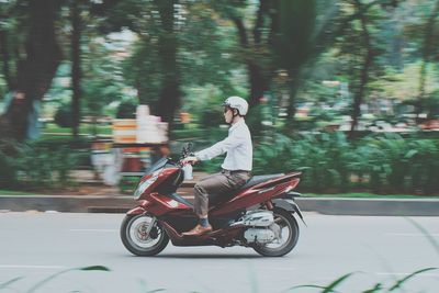 Young woman riding motorcycle