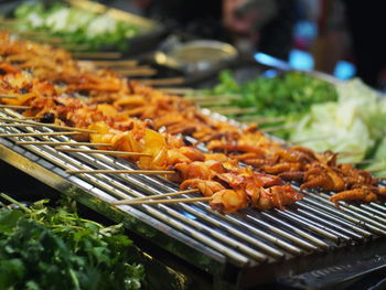 Close-up of meat on barbecue grill