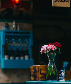 Flowers in vase on table at restaurant