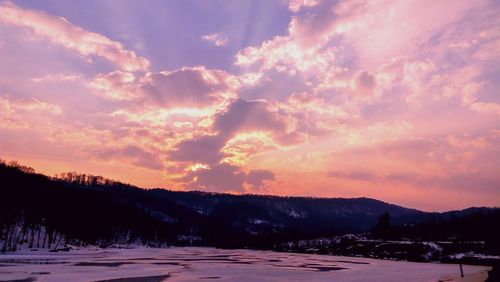 Scenic view of landscape against sky during sunset