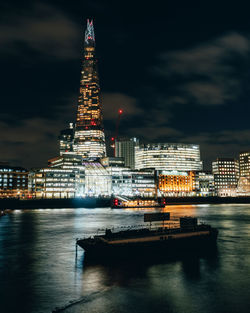 Long exposure shot of the shard and the thames river at night, london