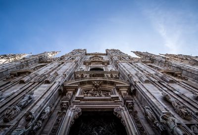 Low angle view of milan cathedral against sky