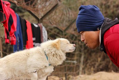 Close-up of man with dog