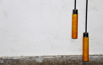 Jump ropes hanging against wall