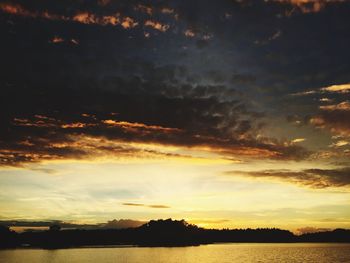 View of calm lake at sunset