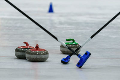 Close-up of curling stones on ice rink