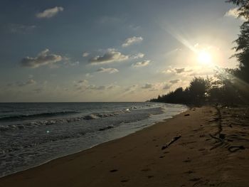 Scenic view of beach against sky during sunset