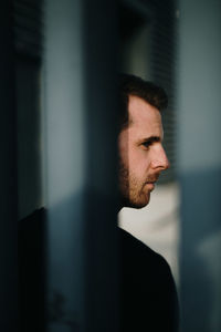 Portrait of young man looking away