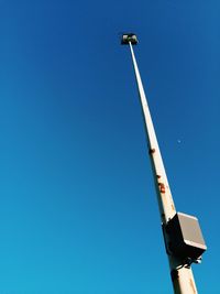 Low angle view of street light against clear blue sky