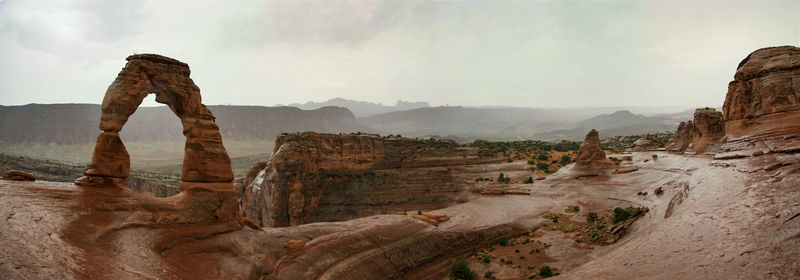 Panoramic view of rock formations against sky