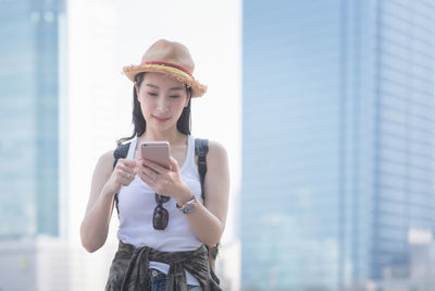 Young woman using mobile phone