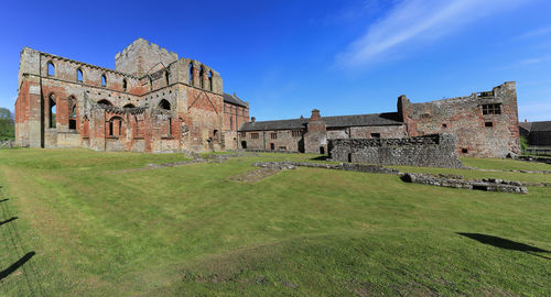 Old ruin building against blue sky