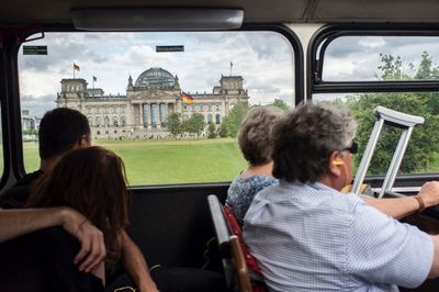 Rear view of man sitting in office building