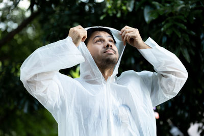 Portrait of young man standing outdoors