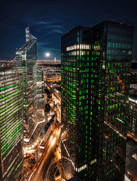 High angle view of illuminated buildings in city at night