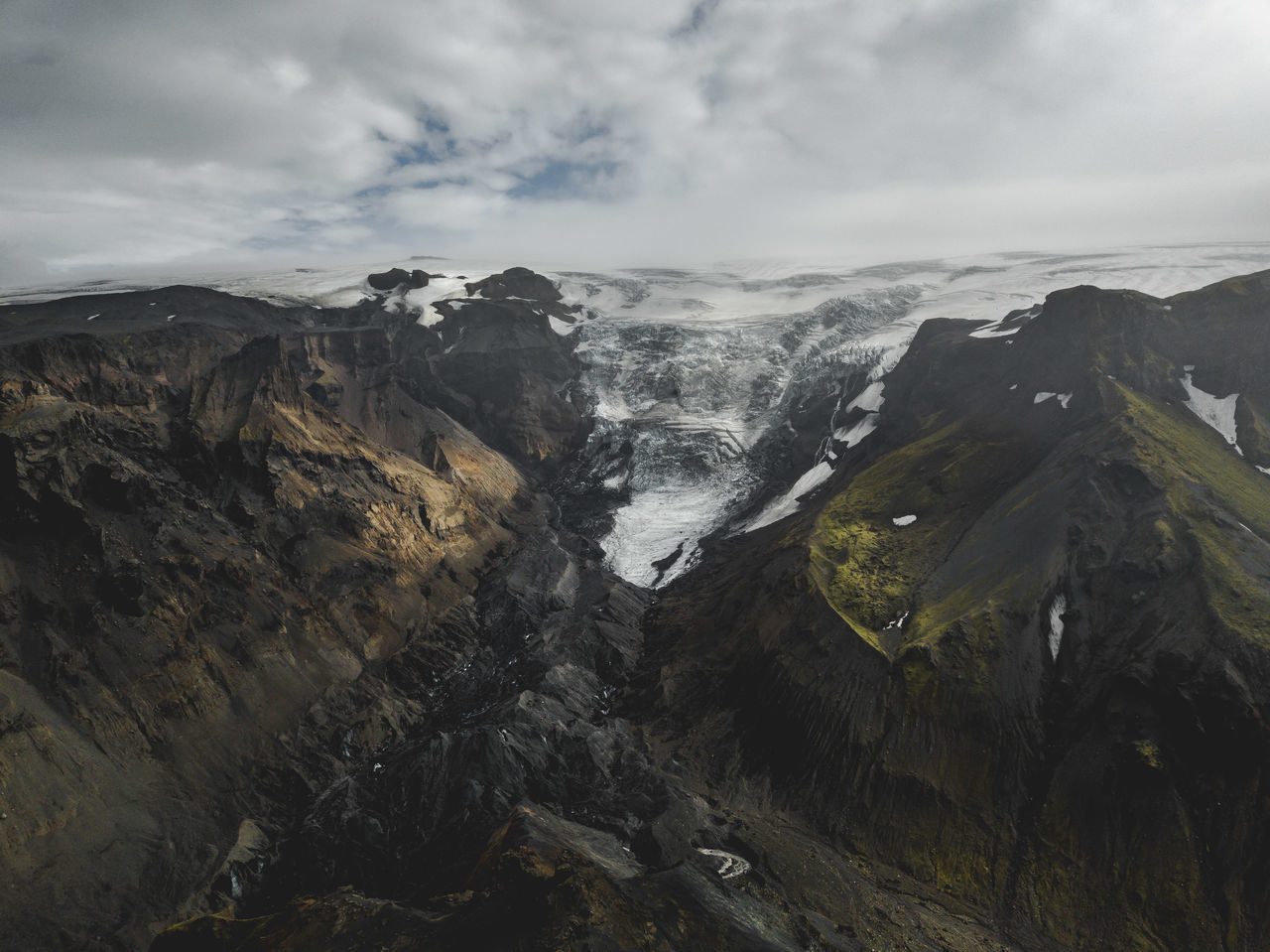 mountain, beauty in nature, sky, scenics - nature, cloud - sky, environment, landscape, rock, non-urban scene, mountain range, nature, no people, tranquil scene, tranquility, day, outdoors, rock - object, cold temperature, remote, mountain peak, formation