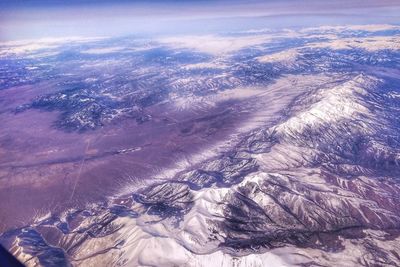 Aerial view of dramatic landscape against sky