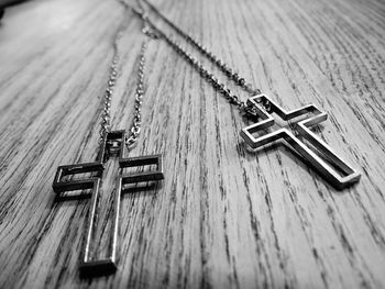 Close-up of chains with cross pendants