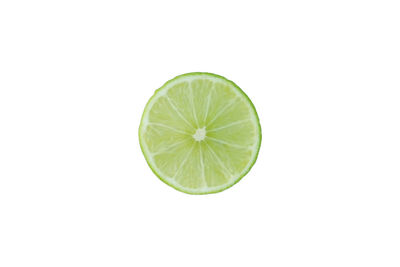 Close-up of lemon slice against white background