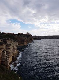 Scenic view of cliff against sky