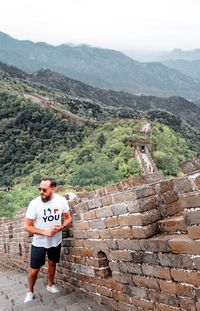 High angle view of man standing on great wall of china