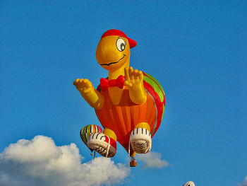 Low angle view of hot air balloon flying against sky