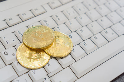 Close-up of bitcoins on keyboard