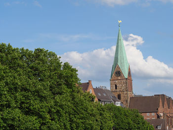 Panoramic view of trees and buildings against sky