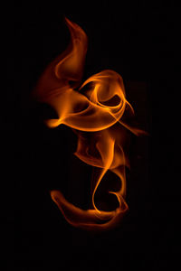 Close-up of fire against black background