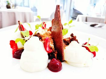 Dessert served in plate on table at restaurant