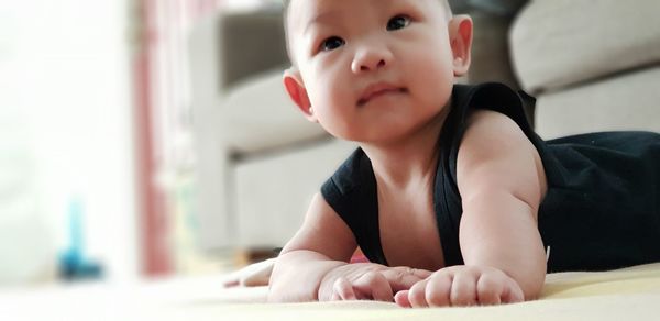 Portrait of cute baby girl at home