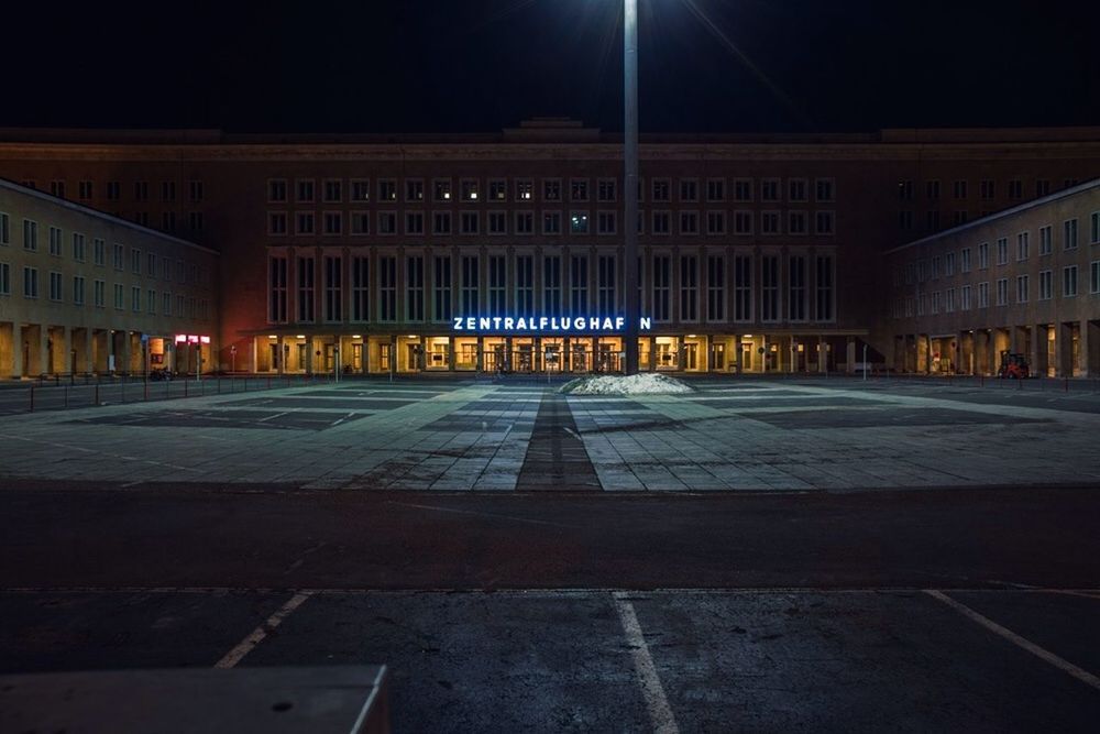 illuminated, architecture, built structure, building exterior, night, city, street, the way forward, lighting equipment, empty, street light, building, sidewalk, light - natural phenomenon, no people, road, outdoors, cobblestone, city life, incidental people