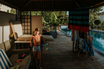 Full length of boy standing in corridor