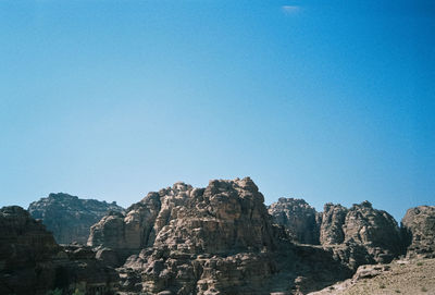 Scenic view of mountains against clear blue sky