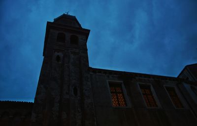 Low angle view of building against blue sky