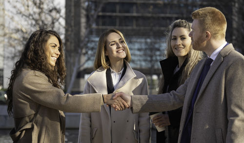 Portrait of smiling couple standing outdoors