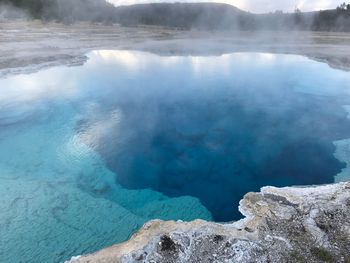 Scenic view of lake at yellowstone national park against sky