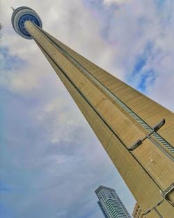 Low angle view of building against cloudy sky