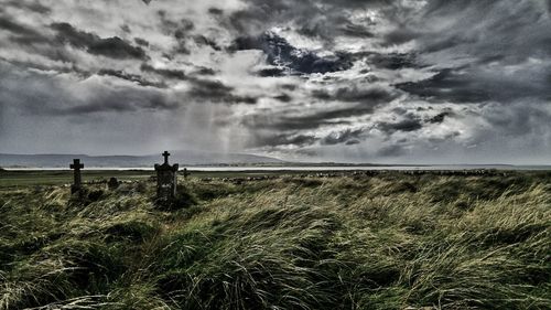 Scenic view of sea against cloudy sky